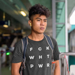 Load image into Gallery viewer, Young man wearing a t-shirt that reads F C K W H T P W R
